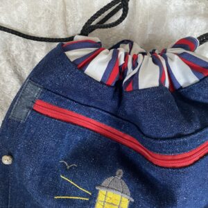 Jeansrucksack mit Leuchtturm